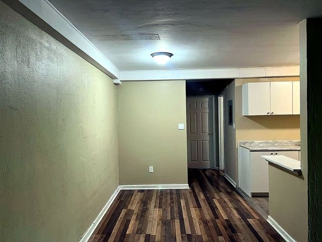 1 Bedroom Apartment at Superior Hill #1G, East Cleveland OH — Kitchen with white cabinets and countertops.