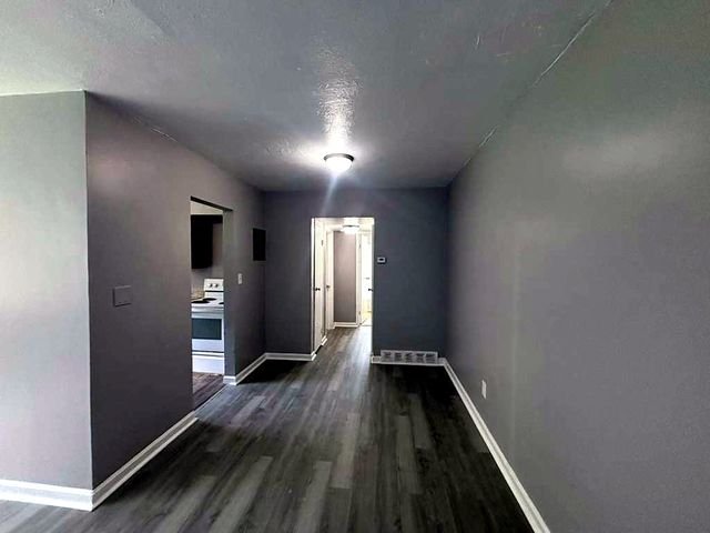 1 Bedroom Apartment at Superior Hill #7B, East Cleveland OH — Hallway with doorway to kitchen and another room.