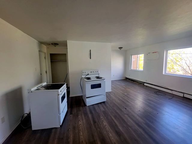 3 Bedroom Apartment at Allen House #307, Cleveland OH — A kitchen with two stoves and a window.