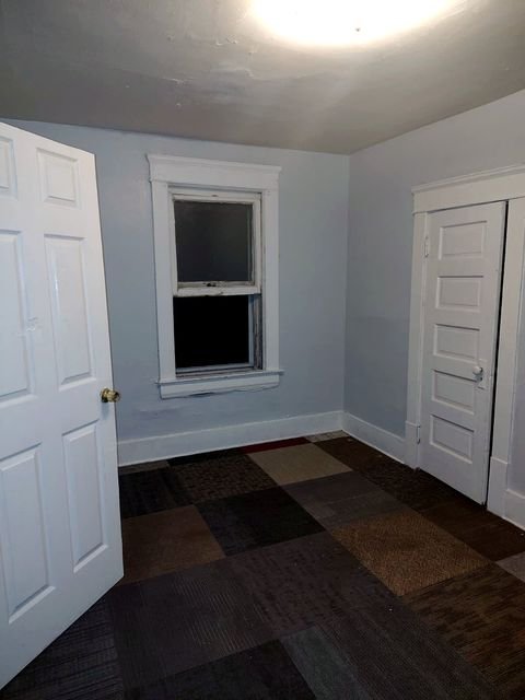 1 Bedroom Apartment at Chittenden #7, Akron OH — Bedroom with two doors and one window.