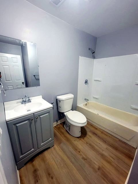3 Bedroom Apartment at Dayton Apartments #1804 - Unit A, Dayton OH — A bathroom with a vanity, toilet, and bathtub.