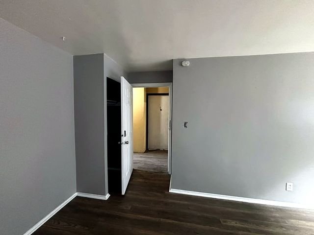 1 Bedroom Apartment at Grovewood #2, Cleveland OH — Bedroom with closet and doorway visible.