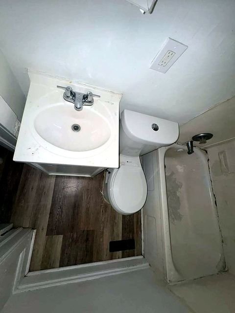 1 Bedroom Apartment at Medellin #4, Cleveland OH — A small bathroom with a toilet and sink.