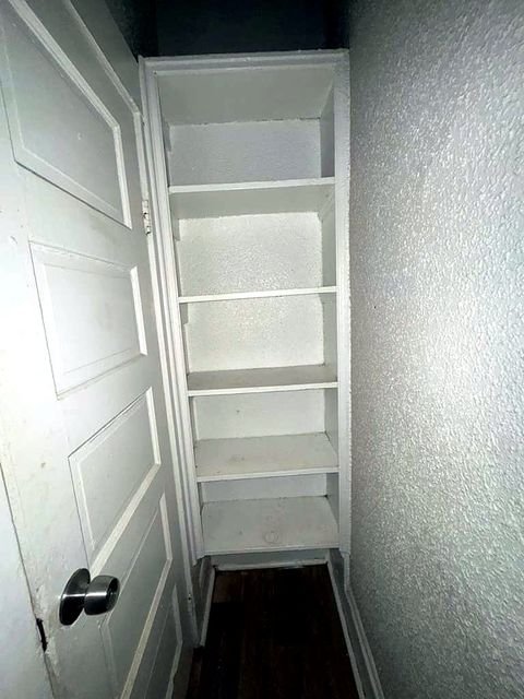 1 Bedroom Apartment at Medellin #4, Cleveland OH — A white built-in closet with shelves is visible.