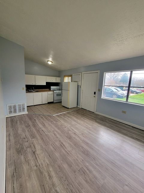 2 Bedroom Apartment at Thurston #1325, Akron OH — A kitchen with white cabinets and appliances.