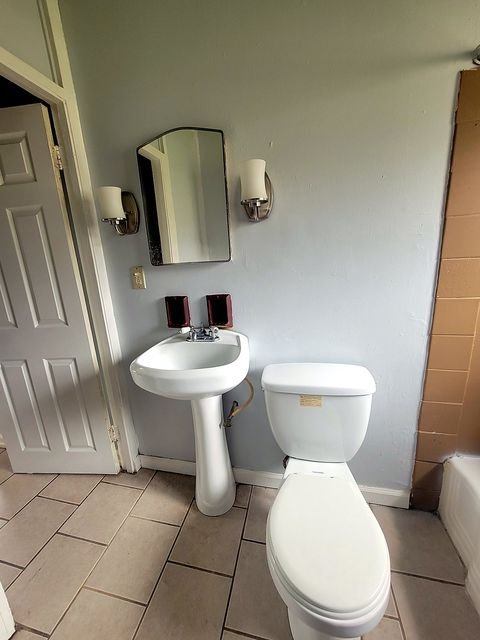 2 Bedroom Apartment at Thurston #1325, Akron OH — A bathroom with a pedestal sink and toilet.