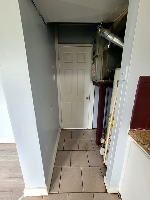 2 Bedroom Apartment at Thurston #1325, Akron OH — Hallway with utility closet and tile flooring.